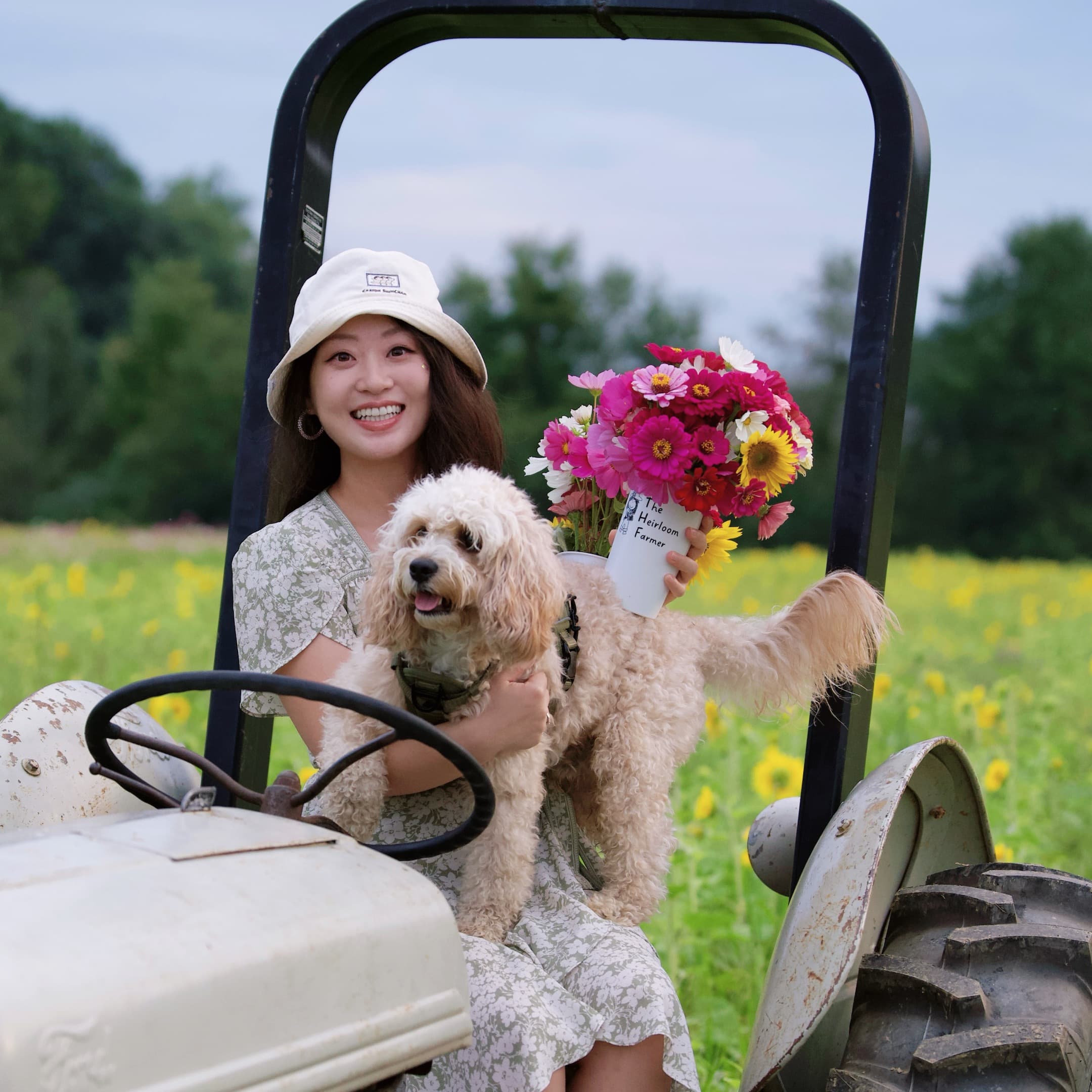 Qingxiao Zheng with her dog and a bouquet of flowers